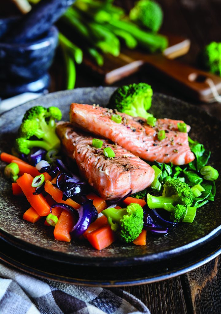 Image of a meal you may learn to cook during Intensive Cardiac Rehabilitation-image of salmon on a bed of vegetables